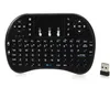 A black wireless keyboard with an integrated touchpad and a USB dongle. Voir les images du produit