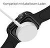 A close-up of a smartwatch being charged wirelessly. Produktbild-Vorschau