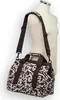 A brown and white patterned duffel bag is displayed on a mannequin. Produktbild-Vorschau