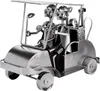 A metallic sculpture of a golf cart with two figures driving it, set against a white background. Podgląd zdjęcia produktu
