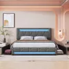 A modern bedroom setting with a grey upholstered bed featuring LED lighting. Náhľad obrázku produktu