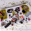 A collection of makeup products arranged on a decorative advent calendar. Produktbild-Vorschau