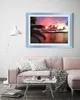 A living room scene with a pink sofa, coffee table, and a framed picture on the wall. Produktbild-Vorschau