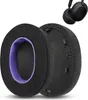 Two black headphone ear pads with purple inner lining are shown against a white background. A pair of black headphones is visible in the upper right corner. Náhled obrázku produktu