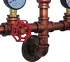 Close-up of a vintage-style pipe fitting with gauges and a red valve. Náhled obrázku produktu