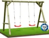 A wooden swing set with two red swings on a patch of green grass. Produktbild-Vorschau