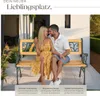 A couple sitting on a garden bench. Náhled obrázku produktu