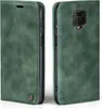 A green flip case for a smartphone, shown from the front and back. Produktbild-Vorschau