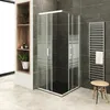 A modern bathroom with a shower cabin, towel rack, and shelving unit. Produktbild-Vorschau