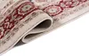 A close-up view of a rolled-up rug, showing its intricate pattern and texture. Náhľad obrázku produktu