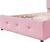 Close-up view of the side of a pink upholstered bed frame with a wooden slat mattress support. Produktbild-Vorschau
