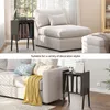 Collage showing a black LP storage unit in two different living room settings. Produktbild-Vorschau