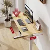 A standing desk with a monitor, keyboard, mouse, and a plant. Podgląd zdjęcia produktu