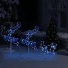 Christmas decorations in a snowy outdoor setting at night. Náhľad obrázku produktu