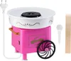 A pink and white cotton candy machine with accessories on a white background. Produktbild-Vorschau