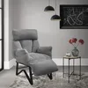 A gray recliner chair is shown in a living room setting, next to a small side table with a vase of flowers. Produktbild-Vorschau