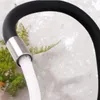 Close-up of a black kitchen faucet with water flowing out. Náhľad obrázku produktu