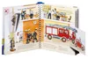 An open pop-up book about a fire station, showing firefighters and fire trucks. Produktbild-Vorschau