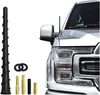 A car antenna and its accessories are displayed against a white background, with part of a car visible on the right. Produktbild-Vorschau
