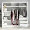 A white wardrobe with clothes and folded items inside. Produktbild-Vorschau