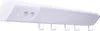 A white power strip with outlets and hooks mounted on a white background. Náhľad obrázku produktu