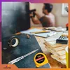 A person is working on a project with tools laid out on a table. Produktbild-Vorschau