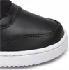 A close-up view of the toe of a black Nike shoe with a white sole. Produktbild-Vorschau