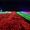 A field of lights at night, with different colored sections. Produktbild-Vorschau