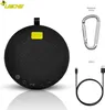 A black Bluetooth speaker with accessories, including a carabiner and a USB-C cable, displayed on a white background. Produktbild-Vorschau