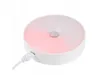 A white, round, wireless LED night light with a motion sensor, plugged in via USB. Produktbild-Vorschau