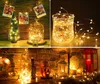 Collage of decorative lighting arrangements, including a mini Christmas tree, a glass dome with lights, and lights in a vase, as well as a fireplace mantle decorated with lanterns and lights. Náhľad obrázku produktu
