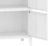 A close-up view of the interior of a white metal cabinet, showing two shelves and the inside of a door. Podgląd zdjęcia produktu