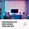 A modern room with 3D wall panels, a desk, computer, and chair, illuminated by colorful LED lights. Produktbild-Vorschau
