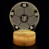 A 3D LED lamp shaped like a soccer ball with FC Barcelona logos, placed on a textured base, against a black background. Voir les images du produit
