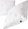 Two white pillows are shown against a white background. One pillow is laid flat, and the other is propped up diagonally. Produktbild-Vorschau