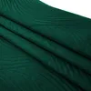 A folded green blanket with a textured pattern. Podgląd zdjęcia produktu