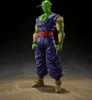 A full-body shot of a Piccolo action figure against a dark, textured background. Podgląd zdjęcia produktu