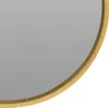 A close-up view of the edge of a round mirror with a golden wooden frame. Náhled obrázku produktu