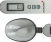 Close-up view of a digital spoon scale. Voir les images du produit