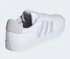 A side view of a white Adidas sneaker. Produktbild-Vorschau