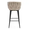 A beige bar stool with a braided seat and black legs, shown from the front against a white background. Podgląd zdjęcia produktu