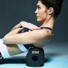 A woman is using a foam roller for self-massage. Produktbild-Vorschau