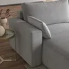 A close-up view of a gray corduroy sofa armrest and cushion, with a small side table and decorative vase in the background. Produktbild-Vorschau