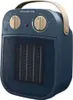 A blue ceramic heater with beige controls and handle, shown from a front-diagonal angle. Voir les images du produit