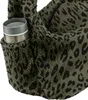 A close-up of a leopard-print bag with a cup holder containing a metal cup. Náhled obrázku produktu