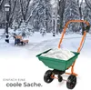 A spreader cart filled with snow in a park during winter. Náhled obrázku produktu