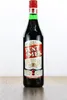 A bottle of Punt e Mes aperitif sits on a wooden surface against a white background. Anteprima dell’immagine prodotto