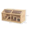 A wooden hamster cage with multiple levels, ramps, and a house. Voir les images du produit