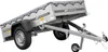 A silver utility trailer with a grey tarp cover, shown from a three-quarter side view against a white background. Podgląd zdjęcia produktu