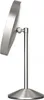 A side view of a silver-colored makeup mirror on a stand, against a white background. Produktbild-Vorschau